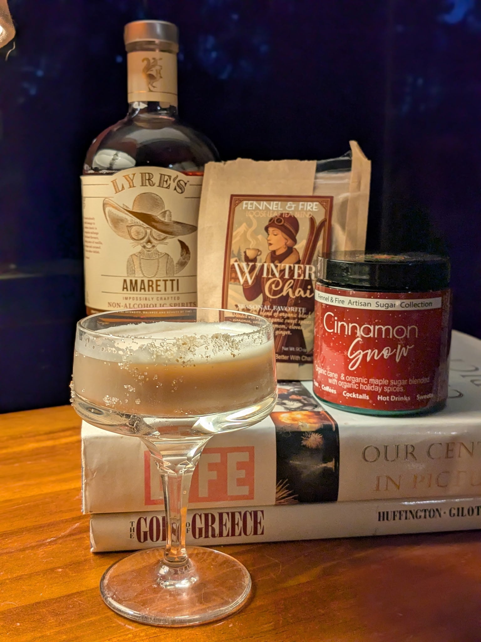 image of Chaitini with a sugar rim and product used to make the drink in background. 