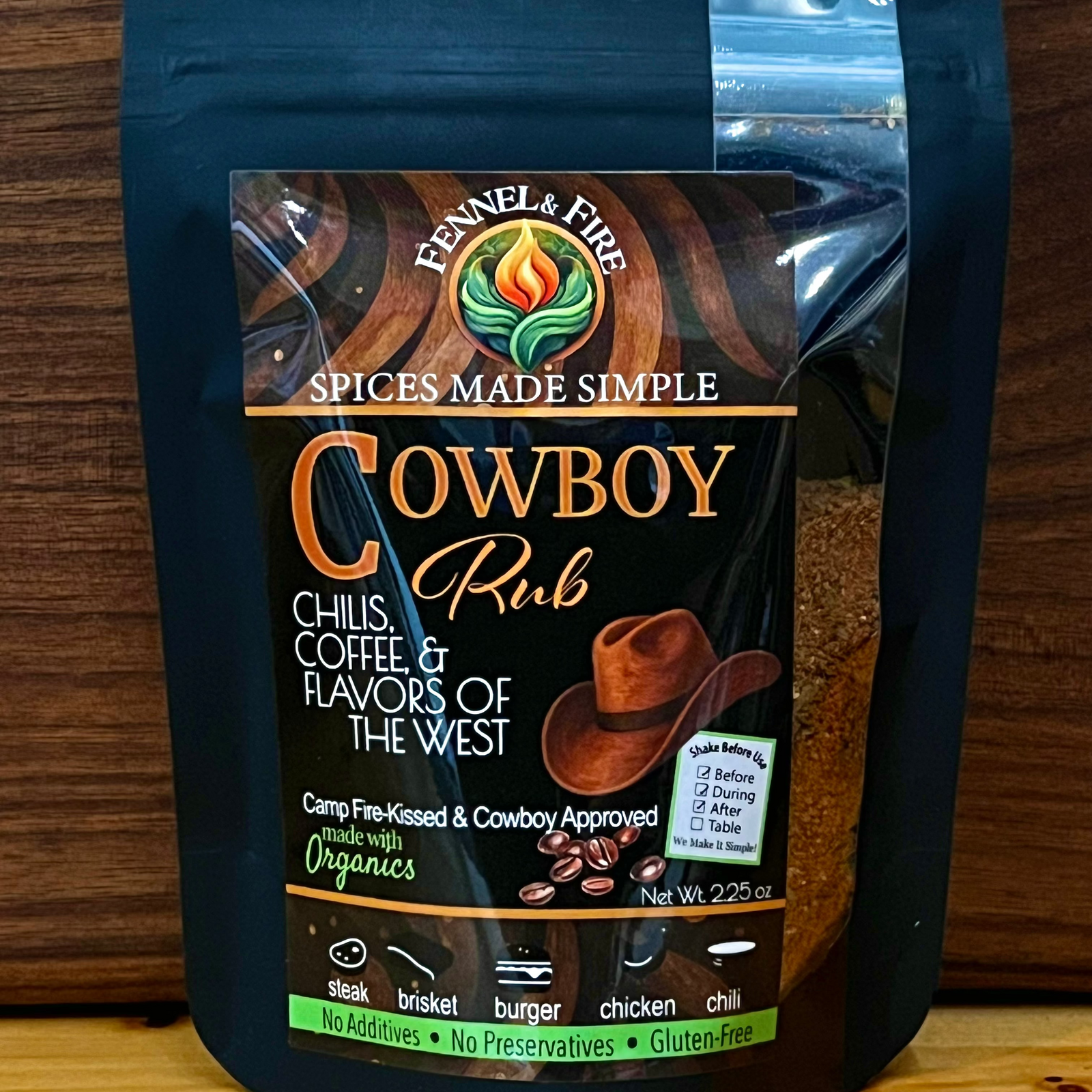 Package of cowboy rub seasoning with branding and product details on a wooden background