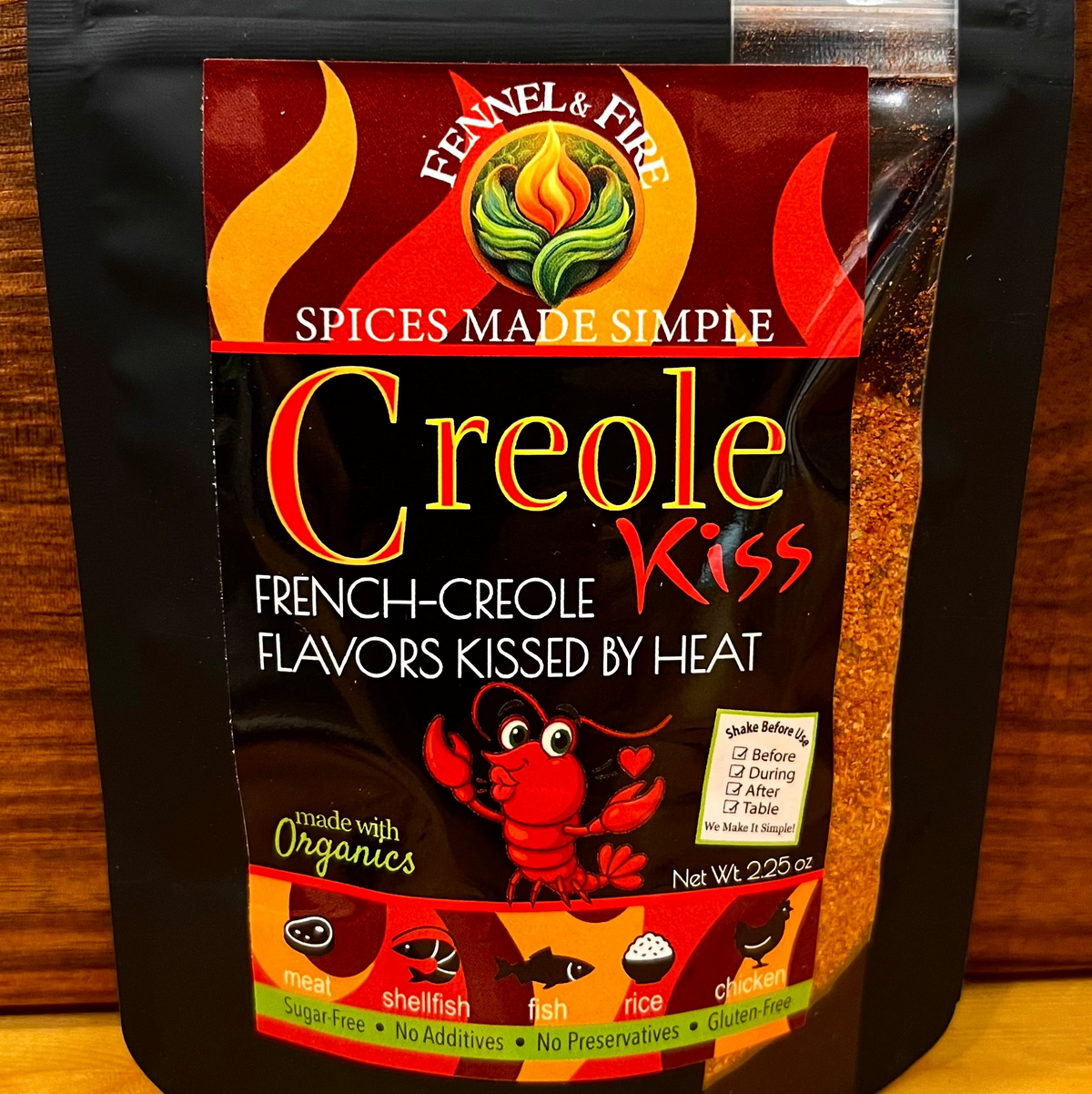 Black spice bag with colorful label on a wooden surface