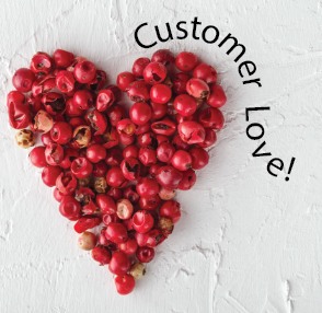 Heart-shaped arrangement of red berries on a white background with 'Customer Love!' text.