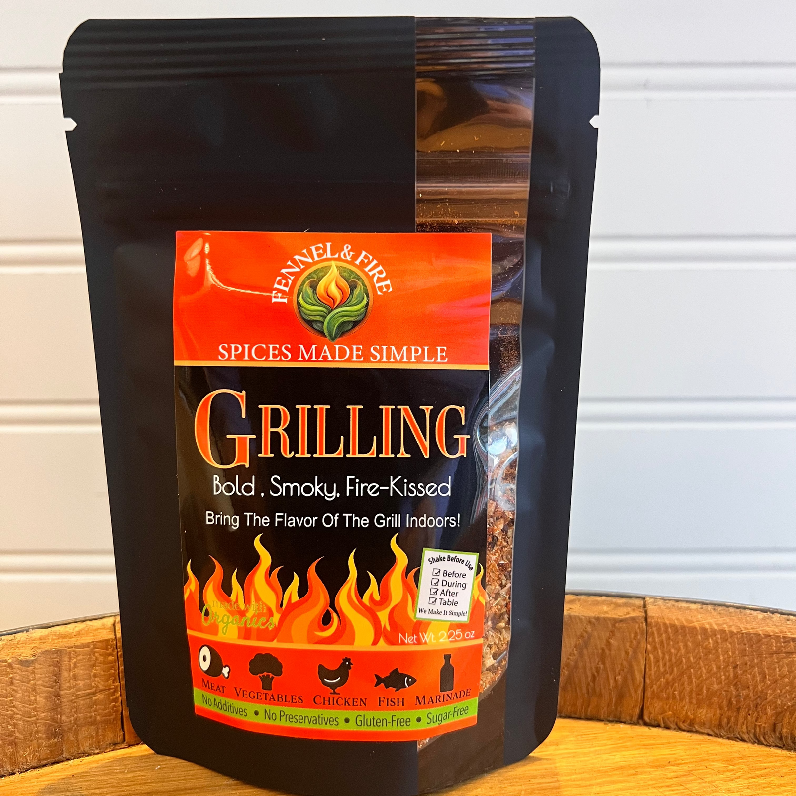 Spices made simple grilling seasoning package on a wooden surface with a white background