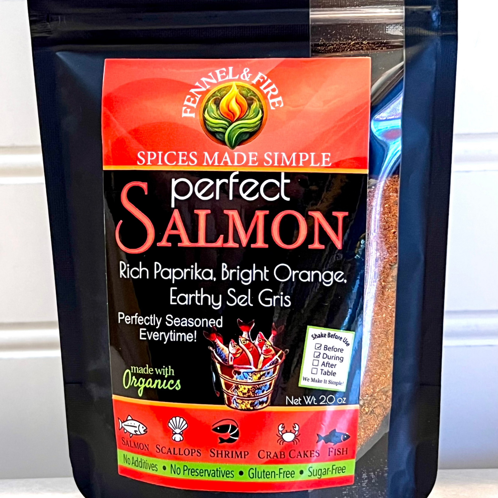 Packaged seasoning mix for salmon with visible branding on a white background