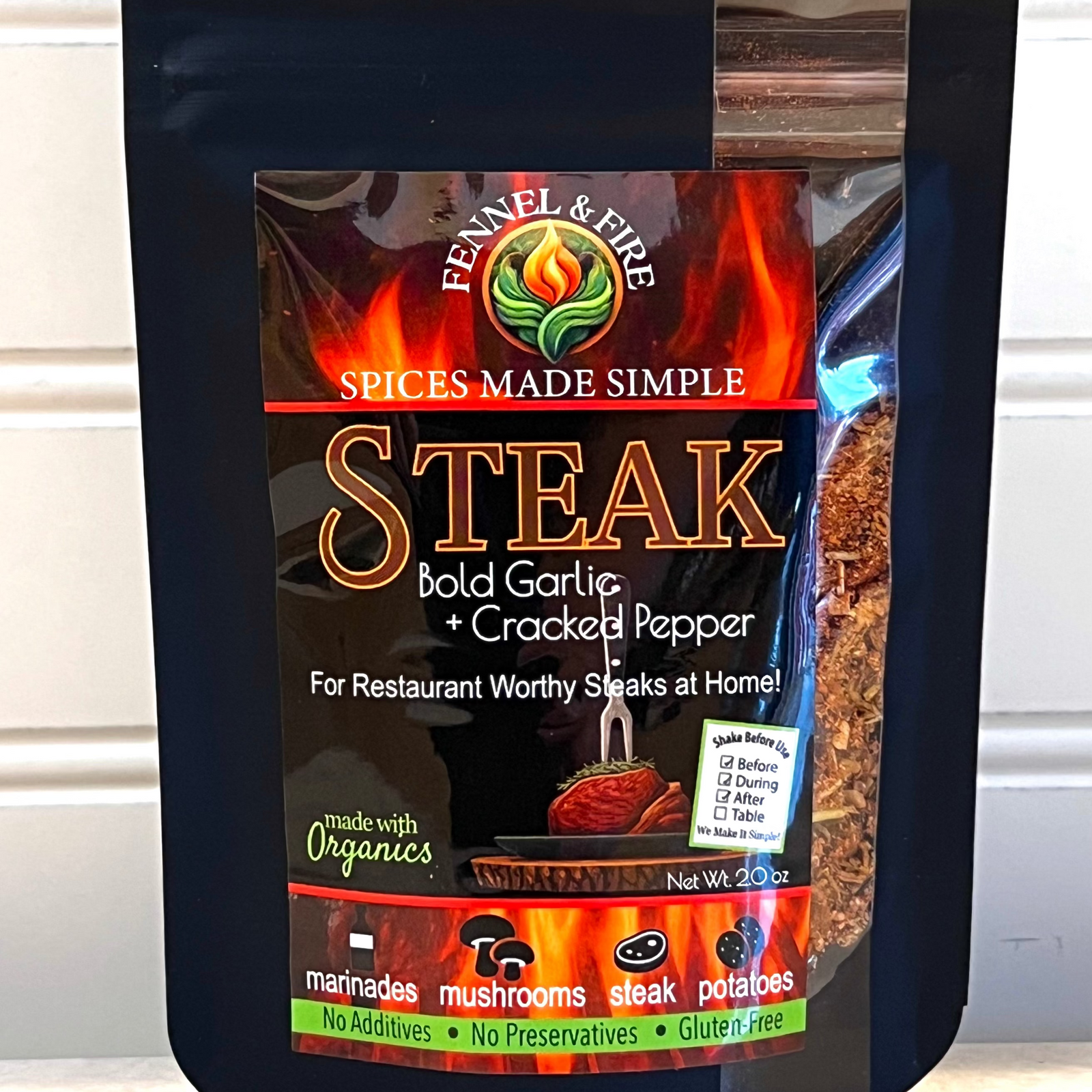 Packaged spice mix for steak seasoning on a white background