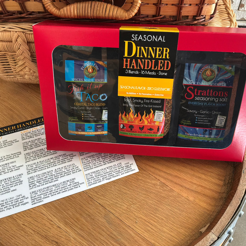 Box of Summer Time Spice Blends on a barrel with picnic baskets. 